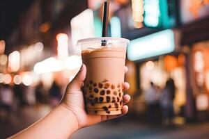 Generative AI illustration of hand holding Taiwan milk tea and blurry background photo