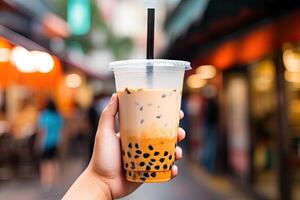 Generative AI illustration of hand holding Taiwan milk tea and blurry background photo