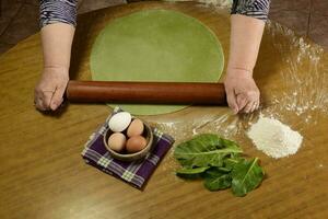 Purple dough bun for noodles with ingredients on the table. photo