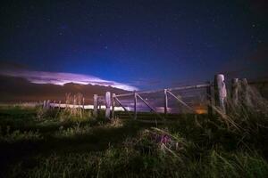 Rural Gate night landscape, and stars, La Pampa Province, Patagonia, Argentina photo