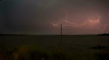 Electric storm in rural Pampas landscape, La Pampa Province, Patagonia, Argentina. photo