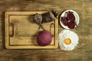 Purple dough bun for noodles with ingredients on the table. photo