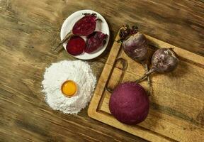 Purple dough bun for noodles with ingredients on the table. photo