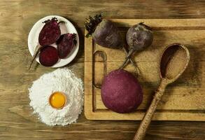 Purple dough bun for noodles with ingredients on the table. photo