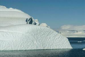 Piece of ice stranded on the beach in Neko Harbour,Antarctica. photo