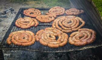 Barbecue, grilled sausages , traditional argentine cuisine photo