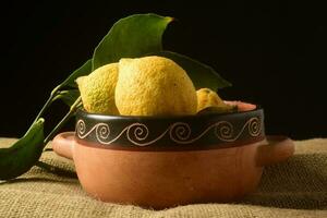 Organic lemons, harvested from the garden, prepared on the table. photo