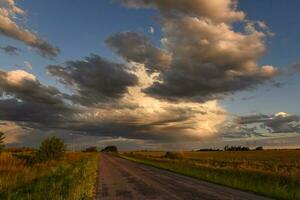 Stormy sky at sunset in the pampas field, La Pampa, Argentina. photo