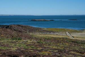 Penguin Island lighthouse, Santa Cruz Province,Patagonia, Argentina photo