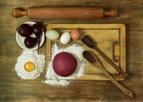 Purple dough bun for noodles with ingredients on the table. photo