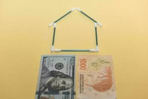 Buy a house, saving concept in dollars photo