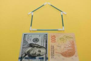 Buy a house, saving concept in dollars photo