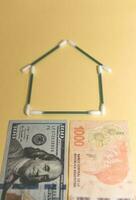 Buy a house, saving concept in dollars photo