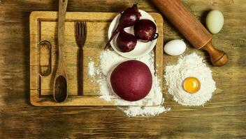 Purple dough bun for noodles with ingredients on the table. photo