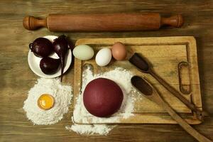 Purple dough bun for noodles with ingredients on the table. photo