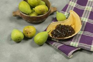 Fresh figs with ingredients on the table. photo