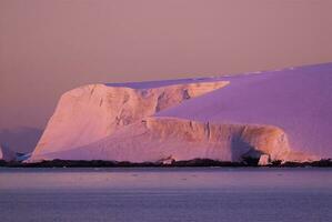 Lemaire strait coastal landscape, mountains and icebergs, Antarctic Peninsula, Antartica. photo