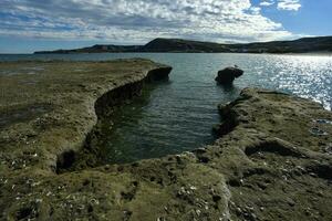 Coastal landscape with cliffs in Peninsula Valdes, World Heritage Site, Patagonia Argentina photo