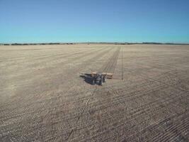 Tractor and seeder, direct sowing in the pampa, Argentina photo