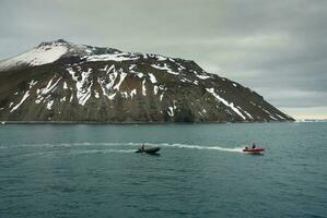 Expedition ship, cruise in Antarctic landscape, Paulet island, near the Antarctic Peninsula photo