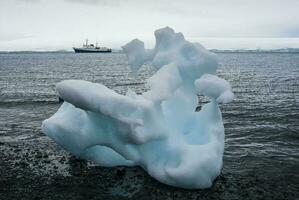 Expedition ship, cruise in Antarctic landscape, Paulet island, near the Antarctic Peninsula photo