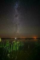 Starry sky reflected in the water, La Pampa Province, Patagonia, Argentina. photo