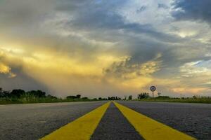 Route crossing the Pampas plain, La Pampa Province, Patagonia, Argentina. photo