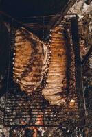 Pork ribs barbecue , Patagonia, Argentina photo