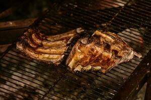 Pig ribbs barbecue , Patagonia, Argentina photo