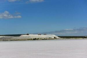 Extraction of raw material salt, from an open pit mine, La Pampa, Argentina photo