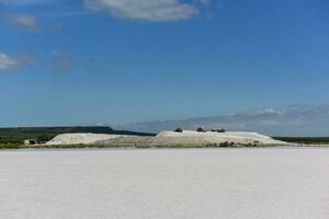 Extraction of raw material salt, from an open pit mine, La Pampa, Argentina photo