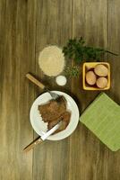 Veal milanese presented on the table with ingredients photo