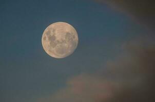 Moon in a sky with clouds,Patagonia Argentina photo