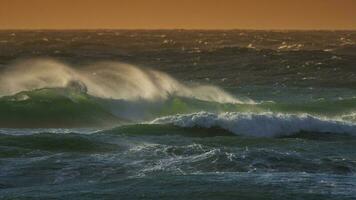 Waves breaking in the ocean, Atlantic Ocean, Patagonia, Argentina photo