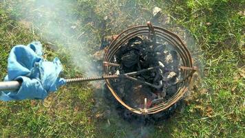 Branding iron is heated to seal cattle video