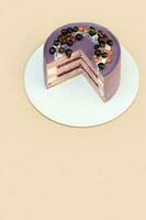 Cake with lavender and currant dough on a beige background photo