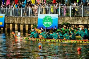 Ho Chi Minh, Viet Nam - 23 April 2023 Blurry motion of boat racing in the traditional Ngo boat racing festival of Khmer people photo