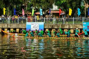 Ho Chi Minh, Viet Nam - 23 April 2023 Blurry motion of boat racing in the traditional Ngo boat racing festival of Khmer people photo