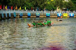 Ho Chi Minh, Viet Nam - 23 April 2023 Blurry motion of boat racing in the traditional Ngo boat racing festival of Khmer people photo