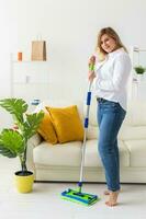 Cleaning woman holding a squeegee mop - house cleaning concept photo