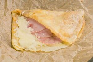 French crepe pancakes stuffed ham and cheese photo