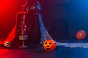 Symbol of Halloween. Jack-o-lantern on a dark background. Halloween card. Lamp in decorations. Background. photo