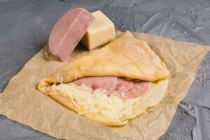 French crepe pancakes stuffed ham and cheese photo