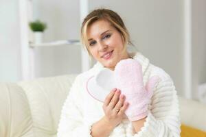 Woman hand holding massage sponge - spa and body care concept photo