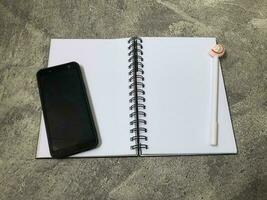 School books, office stationery, gray background photo