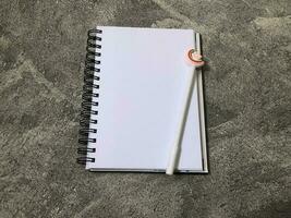 School books, office stationery, gray background photo