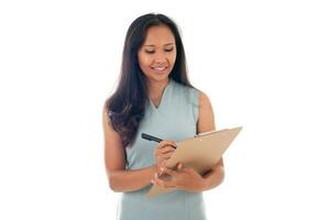 pretty mixed race asian woman posing with clipboard isolated over white background photo