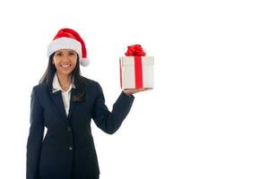 portrait of happy  asian woman in santa hat holding gift box with ribbon , isolated over white background with copyspace photo