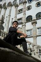 A student taking a selfie in front of the university of Guanajuato, Mexico vibrant city streets photo