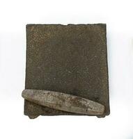 The metate, a rectangular stone tool, embodies the artistry of food preparation, blending corn and tradition photo